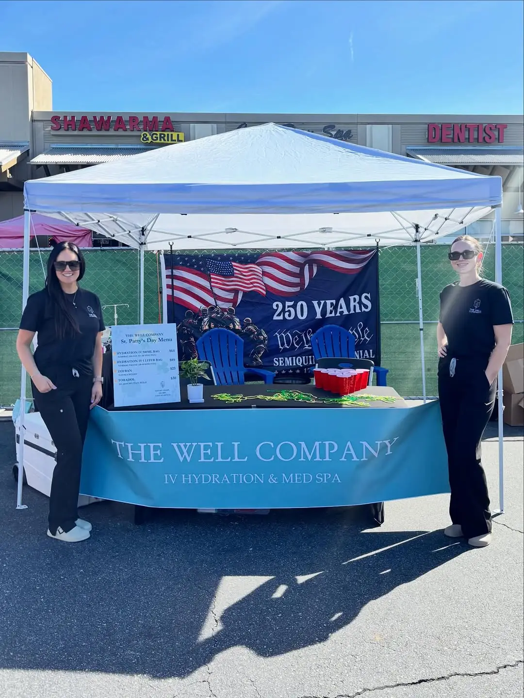 The Well Company team at a community pop-up event booth